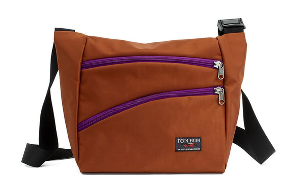 Icon in Burnt Orange 525 Ballistic with Ultraviolet (purple) zippers.